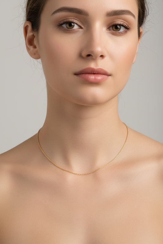 Delicate gold chain necklace on Caucasian model - accurate chain details
