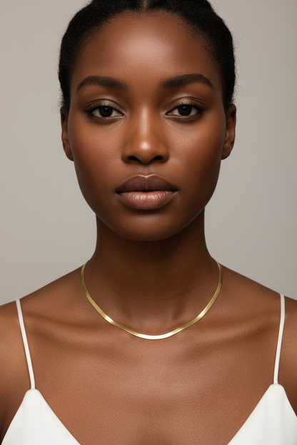 Flat herringbone chain necklace on dark skin model